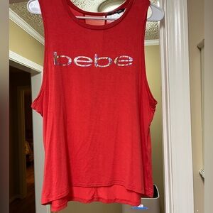 Coral colored Bebe workout tank top. Size medium.